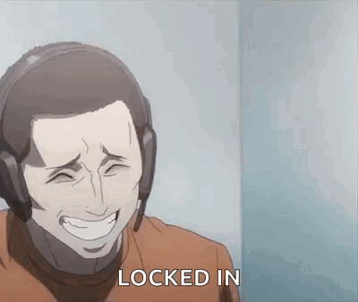 A Man Wearing Headphones Is Laughing And Says `` Locked In '' . GIF