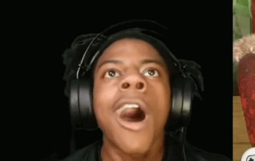 A Man Wearing Headphones Is Making A Funny Face And Looking Up . GIF