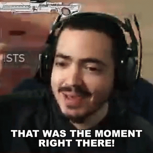 A Man Wearing Headphones Is Making A Funny Face And Saying `` That Was The Moment Right There '' . GIF