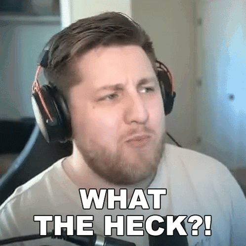 A Man Wearing Headphones Is Making A Funny Face And Says What The Heck ? GIF