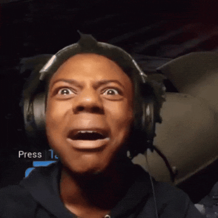 A Man Wearing Headphones Is Making A Funny Face In Front Of A Screen That Says Press GIF