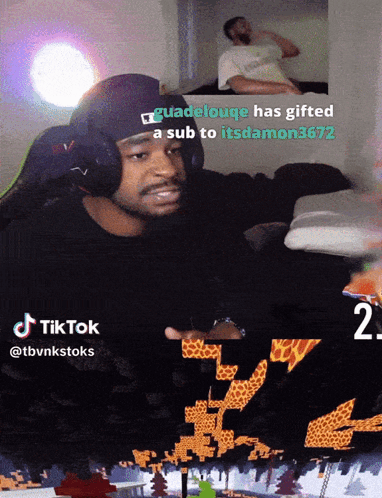 A Man Wearing Headphones Is Playing A Video Game With A Caption That Says Guadeloupe Has Gifted A Sub GIF