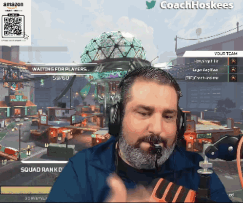 A Man Wearing Headphones Is Playing A Video Game With The Name Coachhoskees On The Bottom Right GIF