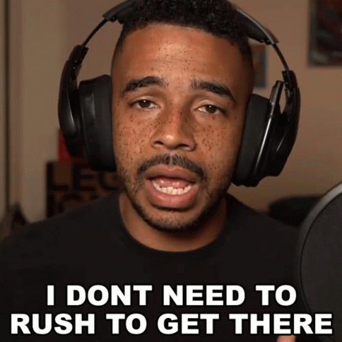 A Man Wearing Headphones Is Saying " I Don T Need To Rush To Get There " GIF