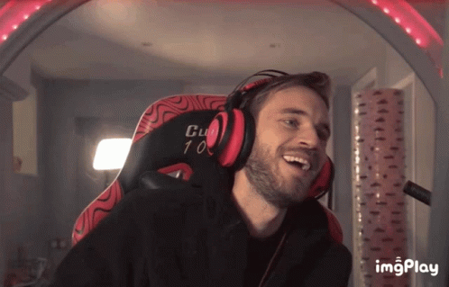 A Man Wearing Headphones Is Sitting In A Chair That Says Club 10 GIF