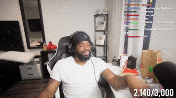 A Man Wearing Headphones Is Sitting In A Chair With His Arms Outstretched And The Number 2,140/3,000 On The Bottom GIF