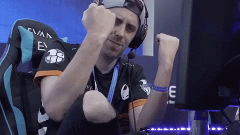A Man Wearing Headphones Is Sitting In A Chair With The Number 26 On The Back GIF