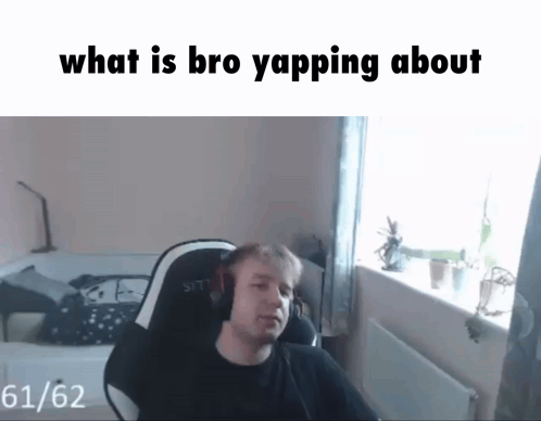 A Man Wearing Headphones Is Sitting In A Chair With The Words " What Is Bro Yapping About " Above Him GIF