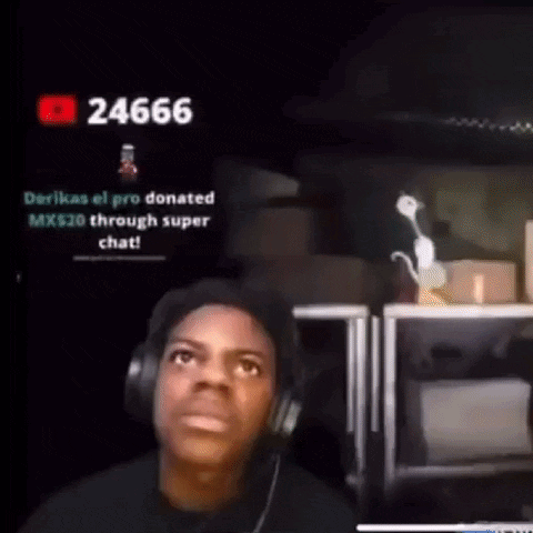A Man Wearing Headphones Is Sitting In Front Of A Computer Monitor . GIF