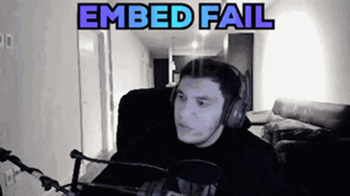 A Man Wearing Headphones Is Sitting In Front Of A Microphone With The Words " Embed Fail " Above Him . GIF