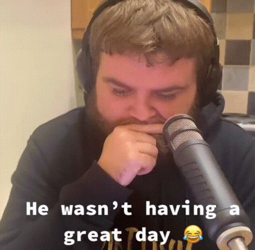 Man With Headphones Sitting In Front Of Microphone GIF