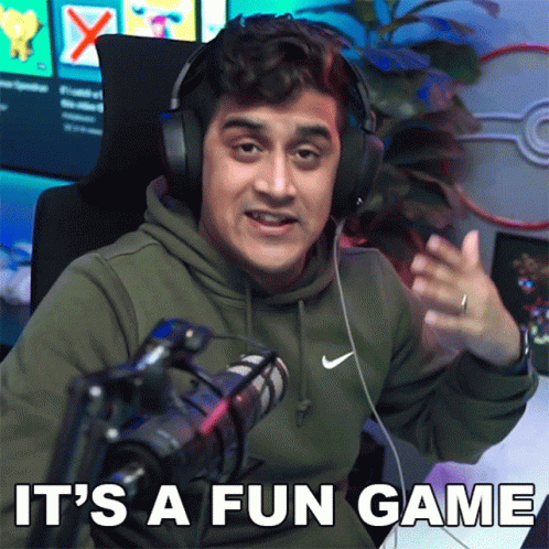 A Man Wearing Headphones Is Sitting In Front Of A Microphone With The Words It 'S A Fun Game Written Below Him GIF