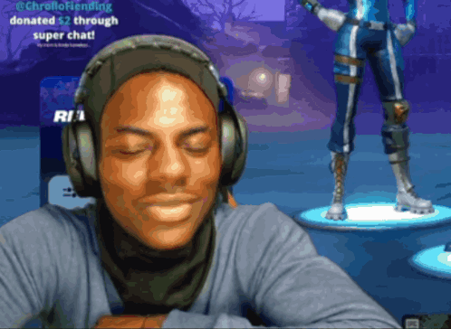 A Man Wearing Headphones Is Sitting In Front Of A Screen That Says ' @Chrellofriending ' On It GIF