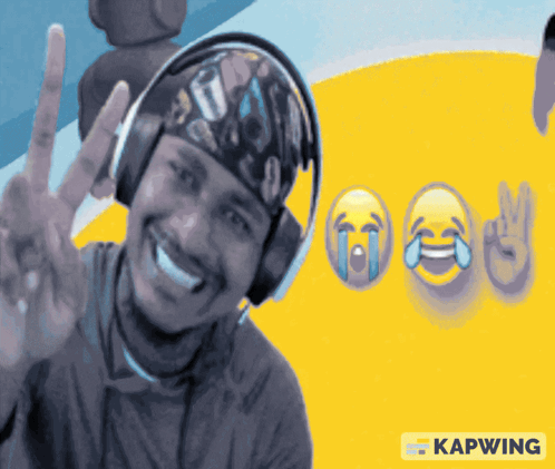 A Man Wearing Headphones Is Smiling And Giving A Peace Sign In Front Of A Yellow Background With Kapwing Written On It GIF