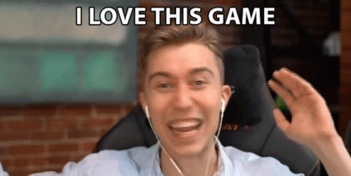 A Man Wearing Headphones Is Smiling And Saying I Love This Game . GIF