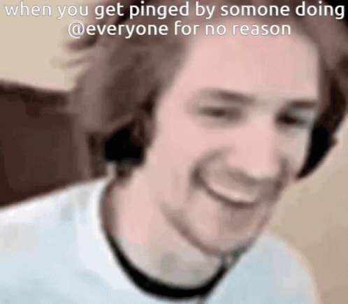 a man wearing headphones is smiling and says when you get pinged by somone doing