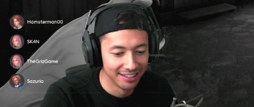A Man Wearing Headphones Is Smiling In Front Of A Screen That Says Hamsterman00 And Skin GIF
