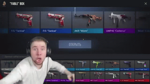 A Man Wearing Headphones Is Standing In Front Of A Rifle That Says Ump45 Cerberus Epic GIF