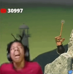 A Man Wearing Headphones Is Standing Next To A Rock And Holding A Hammer . GIF