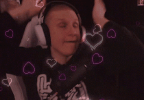 A Man Wearing Headphones Is Surrounded By Hearts That Are Pink And Blue GIF