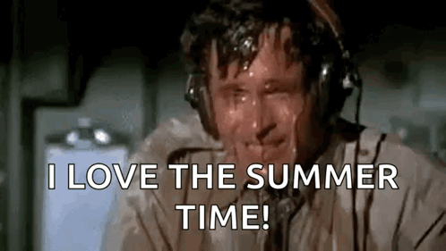 a man wearing headphones is sweating and saying i love the summer time .