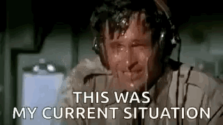 A Man Wearing Headphones Is Sweating While Talking On A Cell Phone . GIF