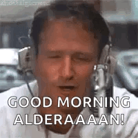 A Man Wearing Headphones Is Talking Into A Microphone And Saying `` Good Morning Alderaaaan '' . GIF