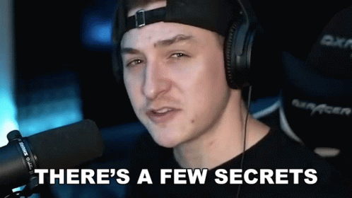 A Man Wearing Headphones Is Talking Into A Microphone And Saying There 'S A Few Secrets . GIF