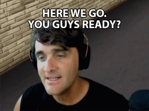 A Man Wearing Headphones Is Talking Into A Microphone And Says `` Here We Go , You Guys Ready '' . GIF
