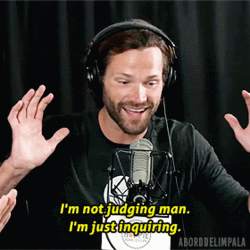 A Man Wearing Headphones Is Talking Into A Microphone And Says I 'M Not Judging Man GIF