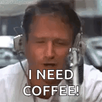 A Man Wearing Headphones Is Talking Into A Microphone And Says `` I Need Coffee ! '' GIF