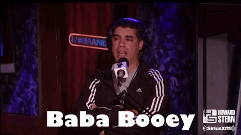 A Man Wearing Headphones Is Talking Into A Microphone With The Words Baba Booey Above Him GIF
