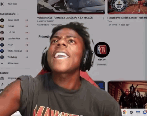 a man wearing headphones is watching a youtube video