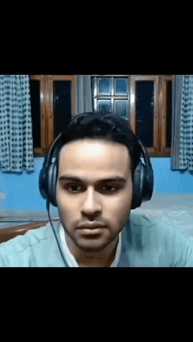 a man wearing headphones looking at the camera