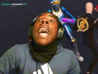 A Man Wearing Headphones Looks Up At A Statue Of A Superhero GIF