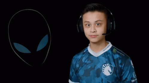 A Man Wearing Headphones Points To An Alien Drawing GIF
