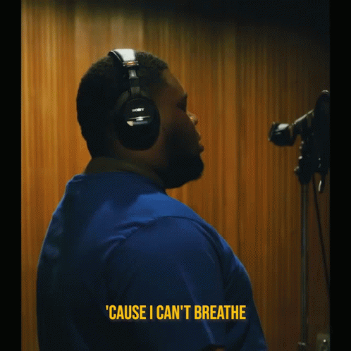 A Man Wearing Headphones Says ' Cause I Can 'T Breathe ' In Yellow Letters GIF