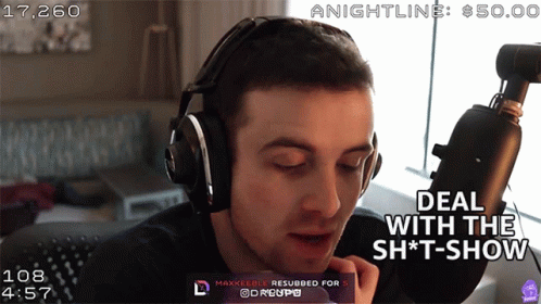 A Man Wearing Headphones Says Deal With The Shit Show GIF