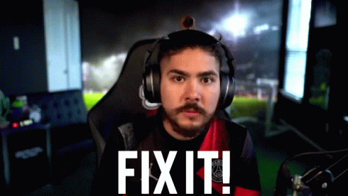 A Man Wearing Headphones Says Fix It In Front Of A Soccer Field GIF