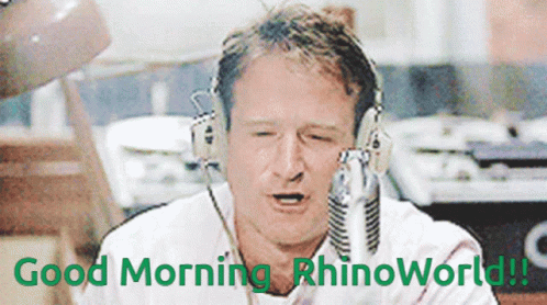 A Man Wearing Headphones Says " Good Morning Rhinoworld " In Green Letters GIF