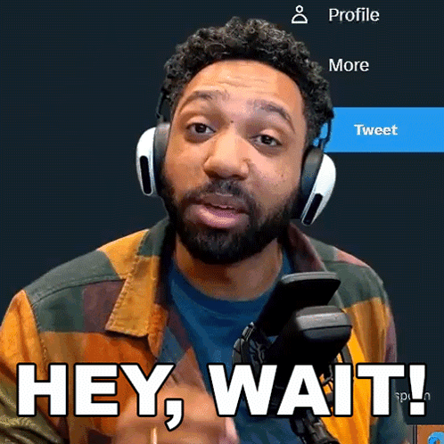 A Man Wearing Headphones Says Hey Wait In Front Of A Microphone GIF