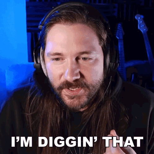 A Man Wearing Headphones Says " I 'M Digging That " GIF