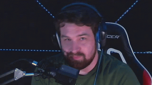 A Man Wearing Headphones Says " It 'S Free Real Estate " While Sitting In Front Of A Microphone GIF