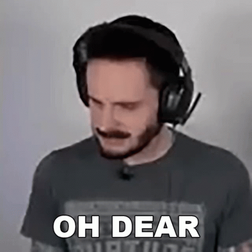 A Man Wearing Headphones Says " Oh Dear " In Front Of His Face GIF