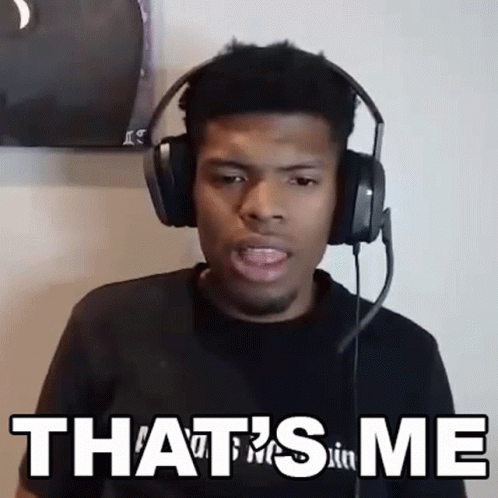 A Man Wearing Headphones Says " That 'S Me " In Front Of Him GIF