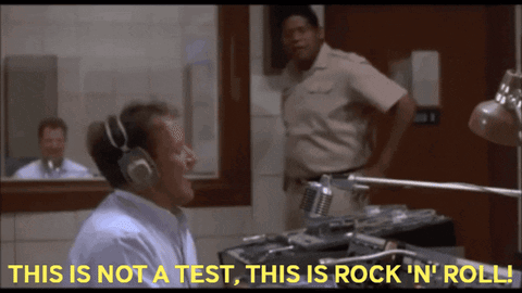 A Man Wearing Headphones Says " This Is Not A Test This Is Rock ' N ' Roll " GIF