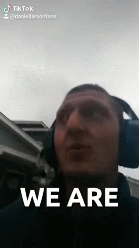 A Man Wearing Headphones Says We Are On A Tik Tok Video GIF