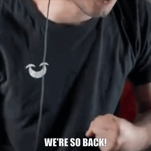 A Man Wearing Headphones Says We Are So Back . GIF