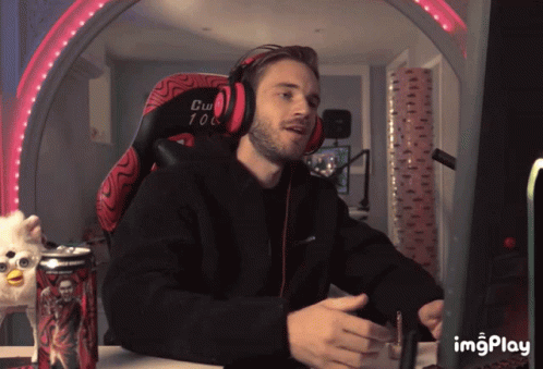 A Man Wearing Headphones Sits In A Chair That Says Cw 108 On It GIF