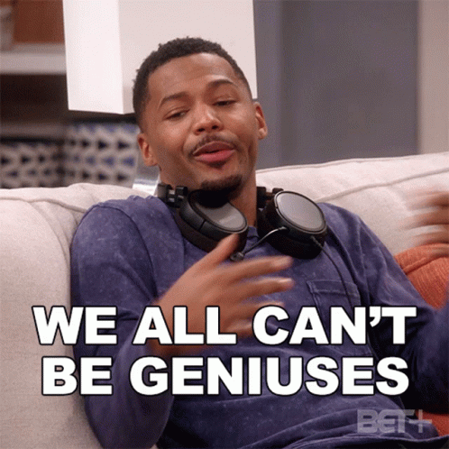 A Man Wearing Headphones Sitting On A Couch With The Words We All Can 'T Be Geniuses Below Him GIF